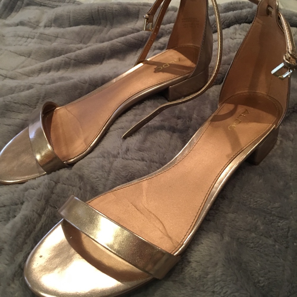 Rose gold flat sandals with ankle strap